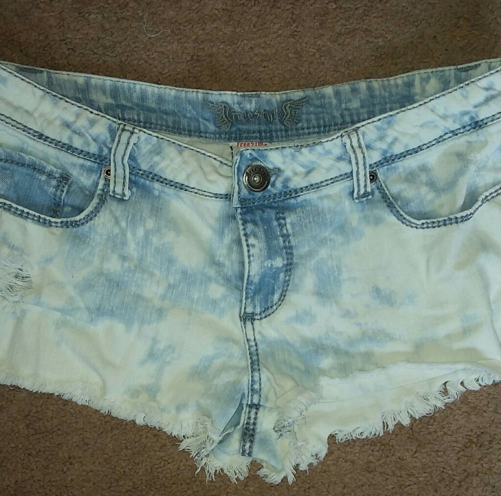 Light blue and white jean shorts.